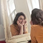 Photo of Woman Looking at the Mirror